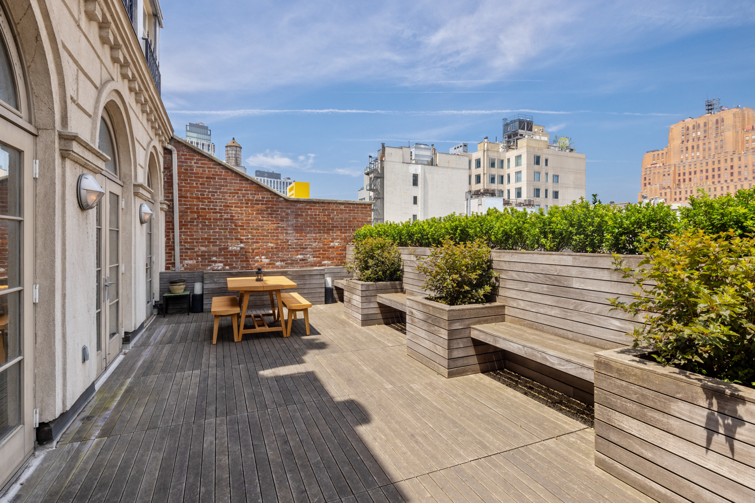 41 Warren Street, Unit 6 Manhattan, NY 10007 - Photo 21 of 23 a view of a balcony with chairs and wooden floor