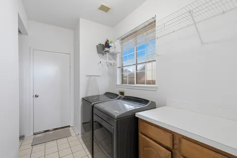 a utility room with washer and dryer
