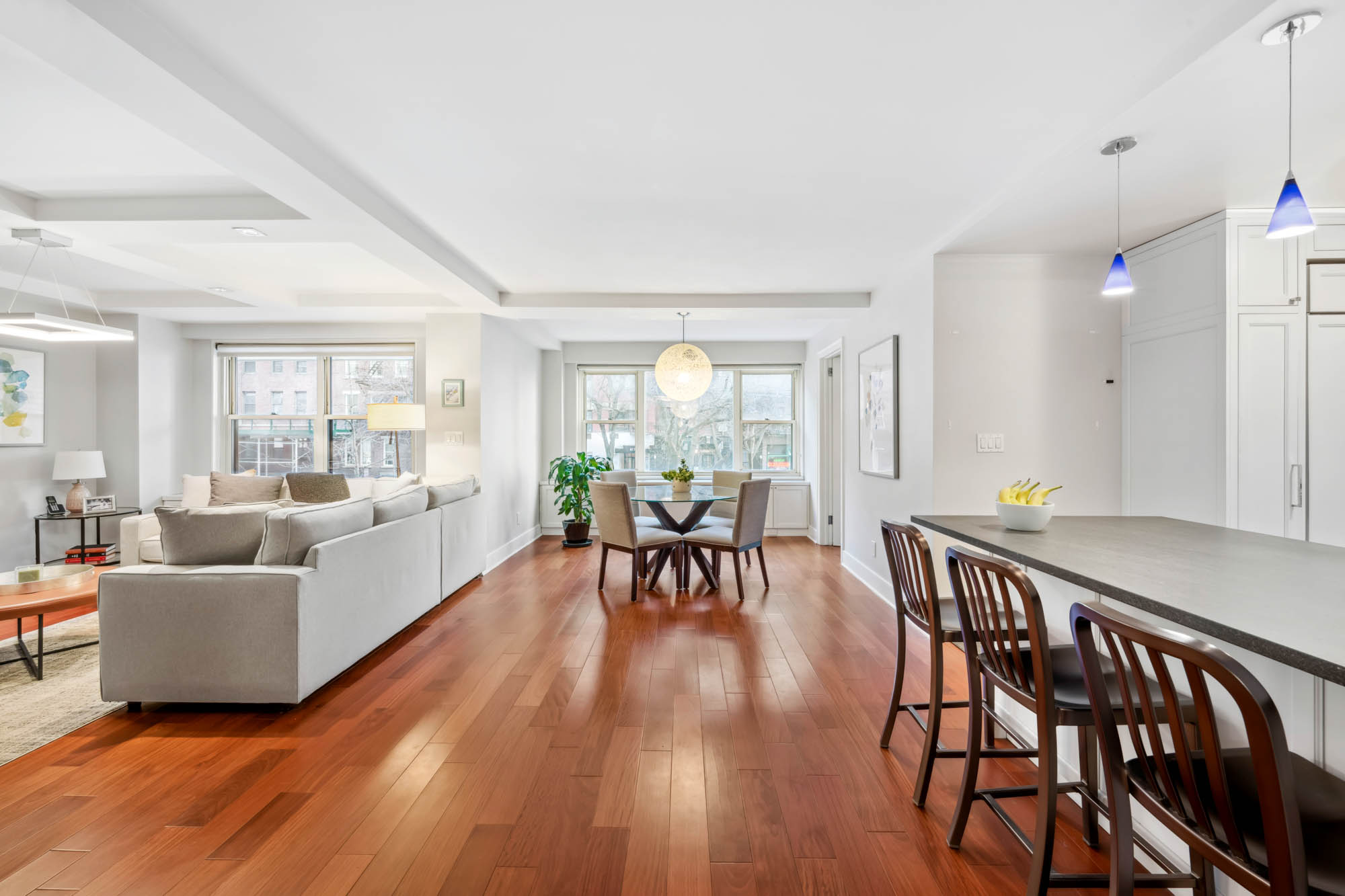 420 East 72nd Street, Unit 2J Manhattan, NY 10021 - Photo 3 of 12 a living room with furniture and wooden floor