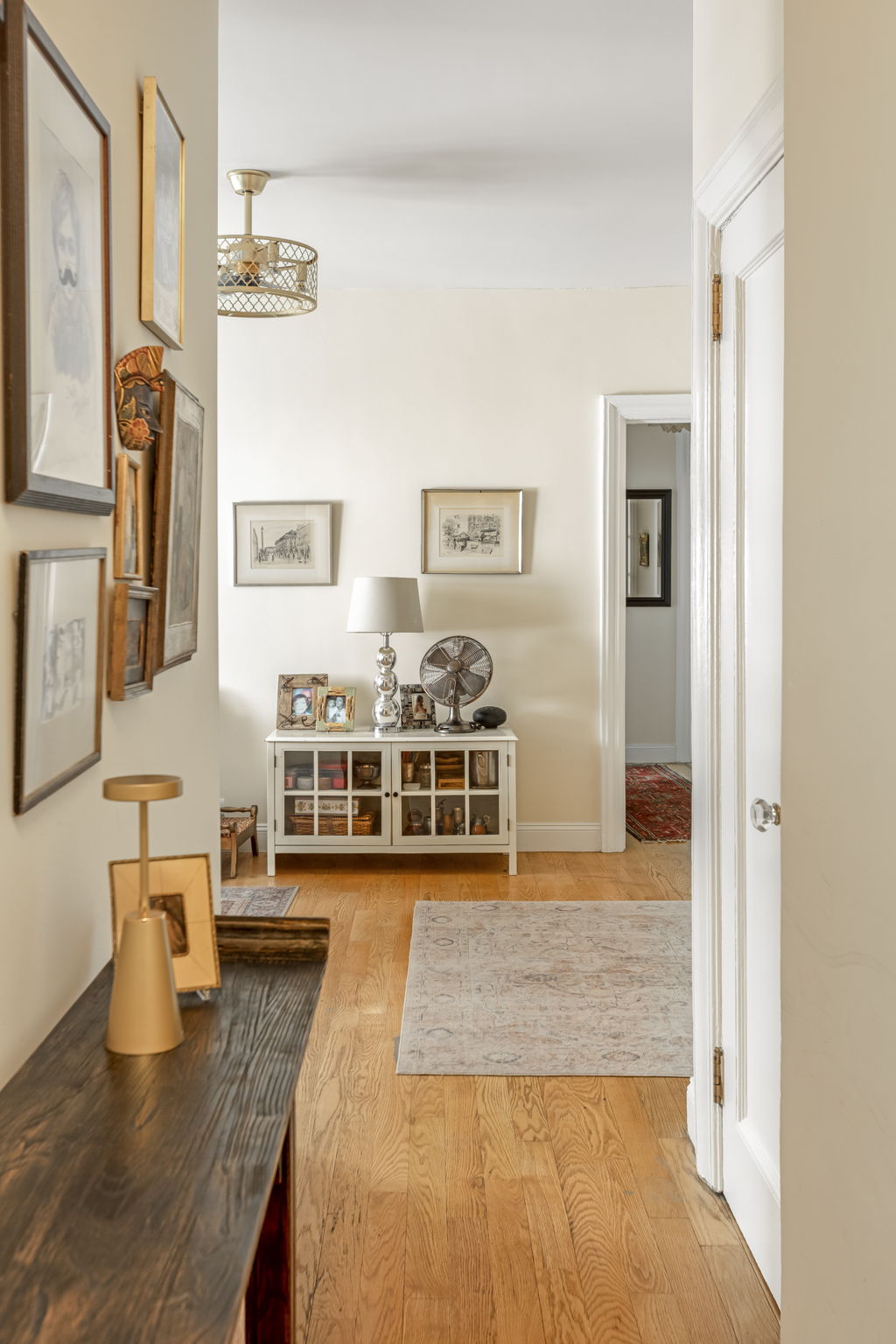 345 East 77th Street, Unit 3C Manhattan, NY 10075 - Photo 2 of 8 a living room with furniture and a flat screen tv