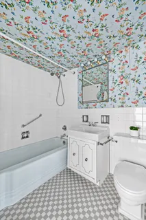 a bathroom with a sink a toilet and a bathtub