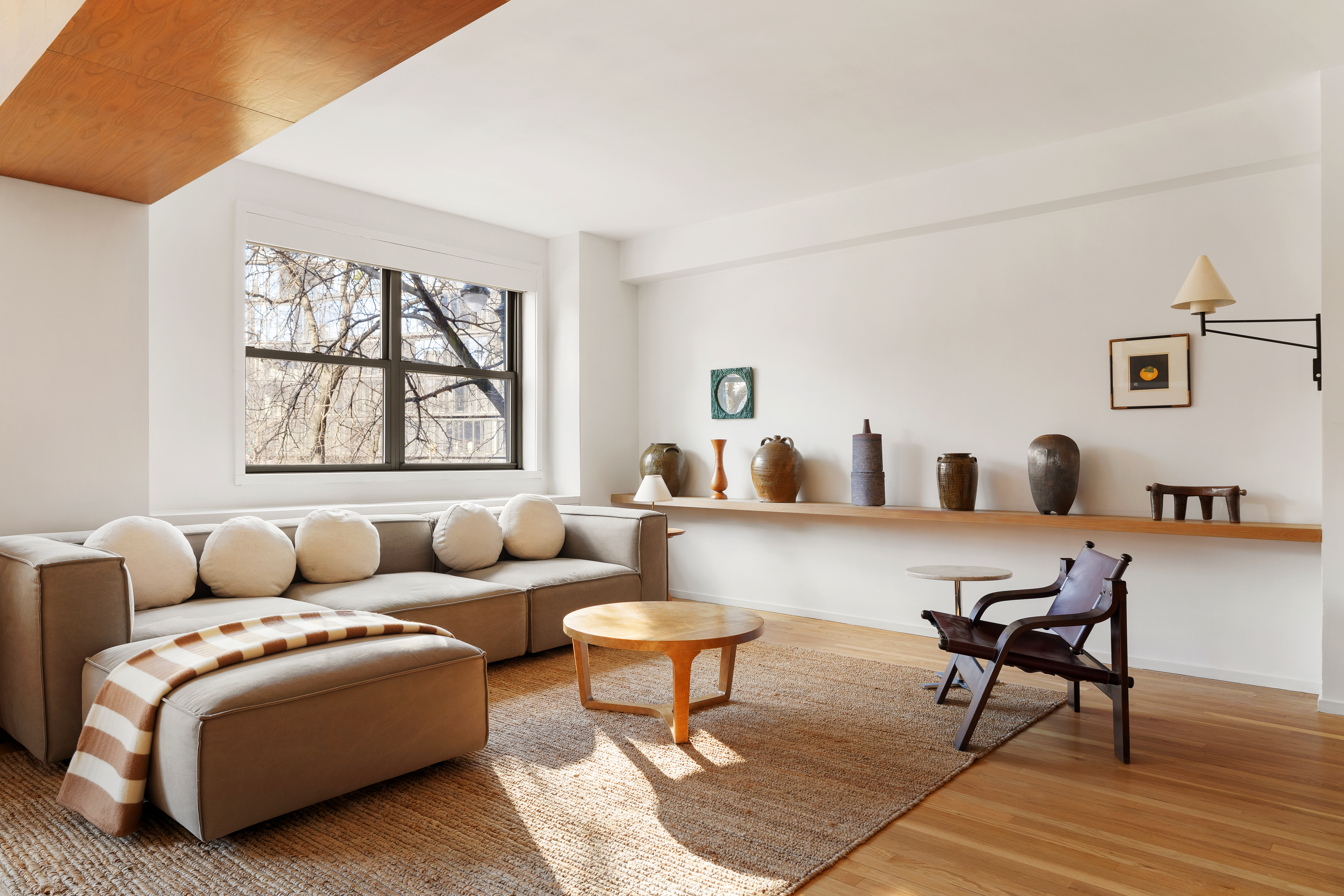 2 Horatio Street, Unit 2PR Manhattan, NY 10014 - Photo 3 of 14 a living room with furniture and a large window