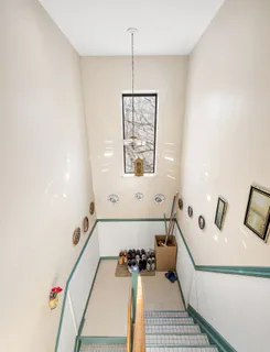 a bathroom with a bathtub and a window