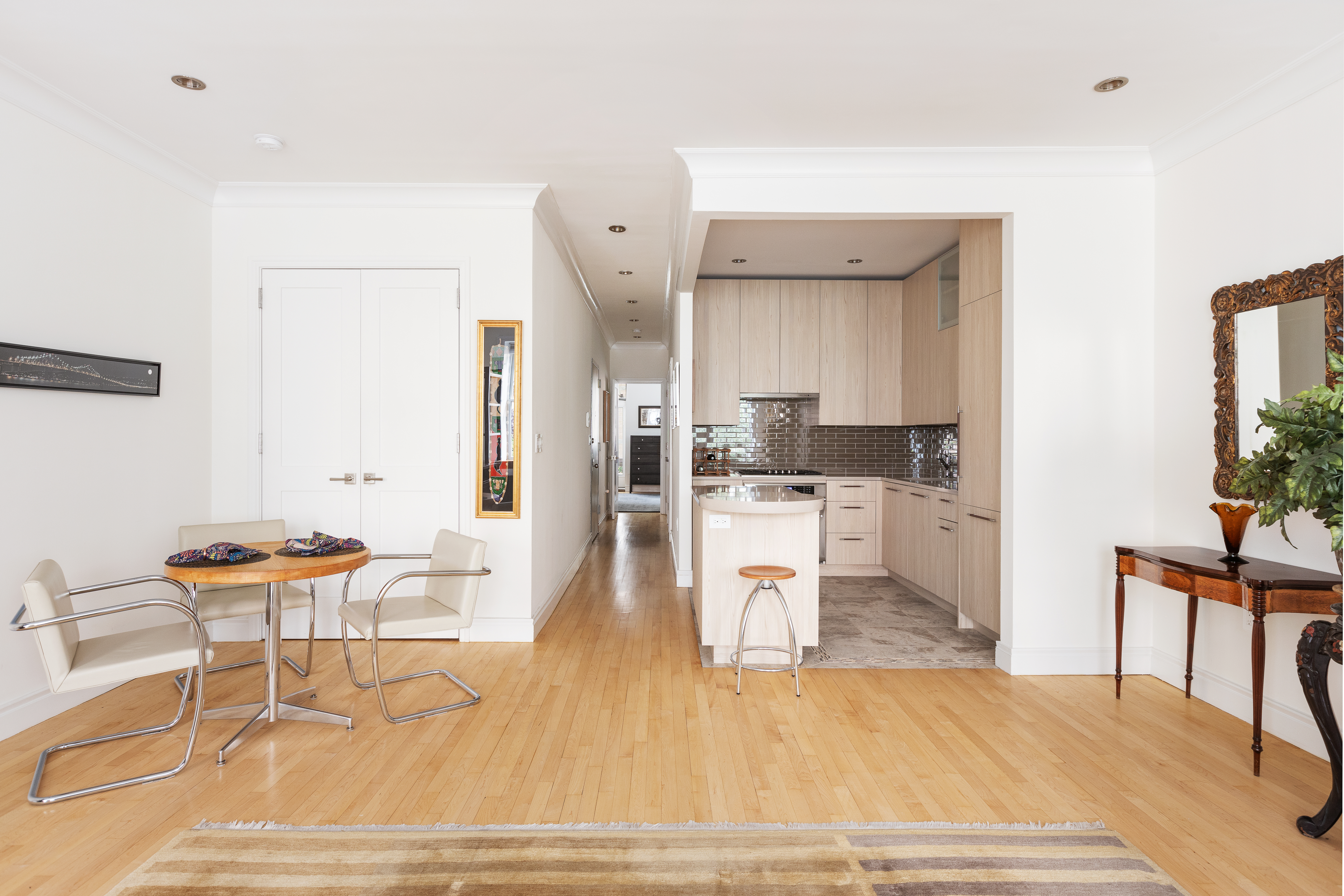 203 East 7th Street, Unit 2 Manhattan, NY 10009 - Photo 3 of 9 a living room with furniture and a wooden floor
