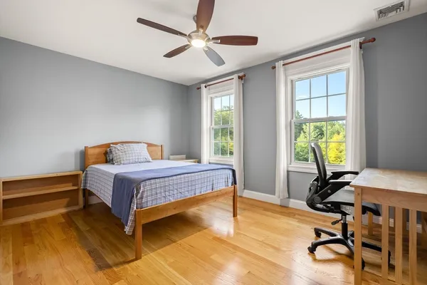 a bedroom with a bed and a table