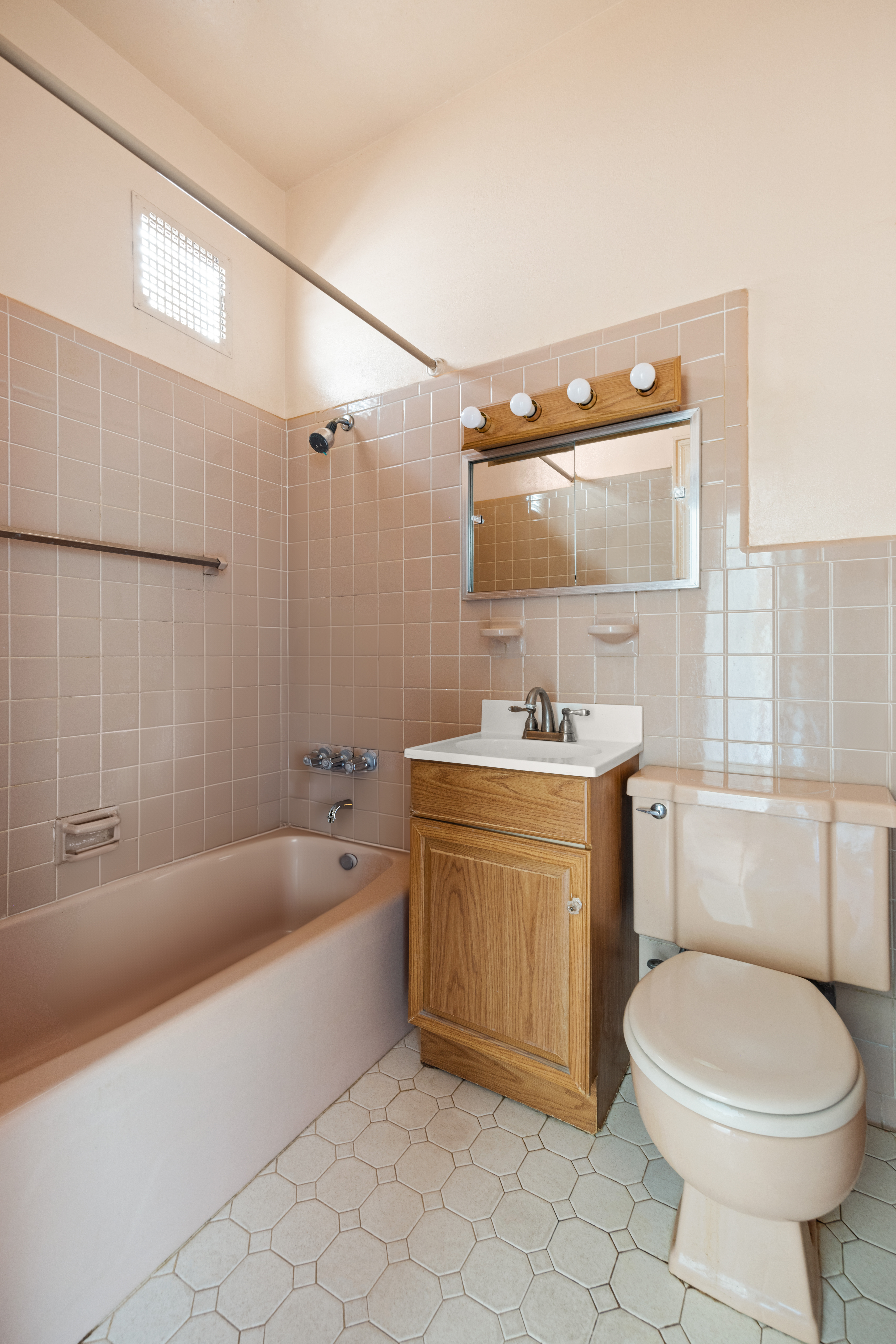273 Windsor Place Brooklyn, NY 11218 - Photo 24 of 29 a bathroom with a sink a toilet and bathtub