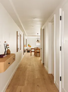 a spacious bathroom with a tub sink and mirror