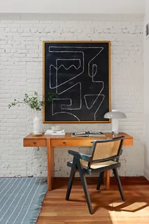 a wooden bench sitting in front of a building