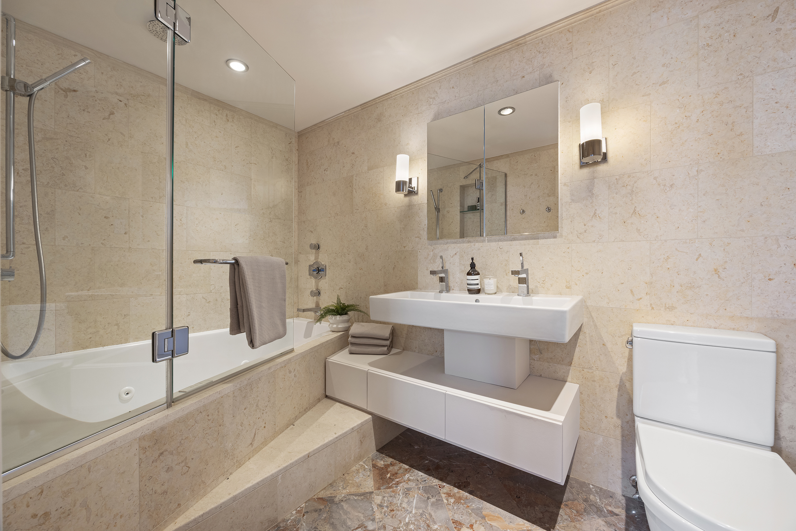 100 Reade Street, Unit 6CD Manhattan, NY 10013 - Photo 14 of 26 a bathroom with a sink a toilet and a large mirror