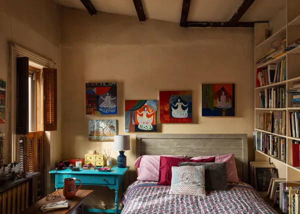 a bedroom with a bed and a window