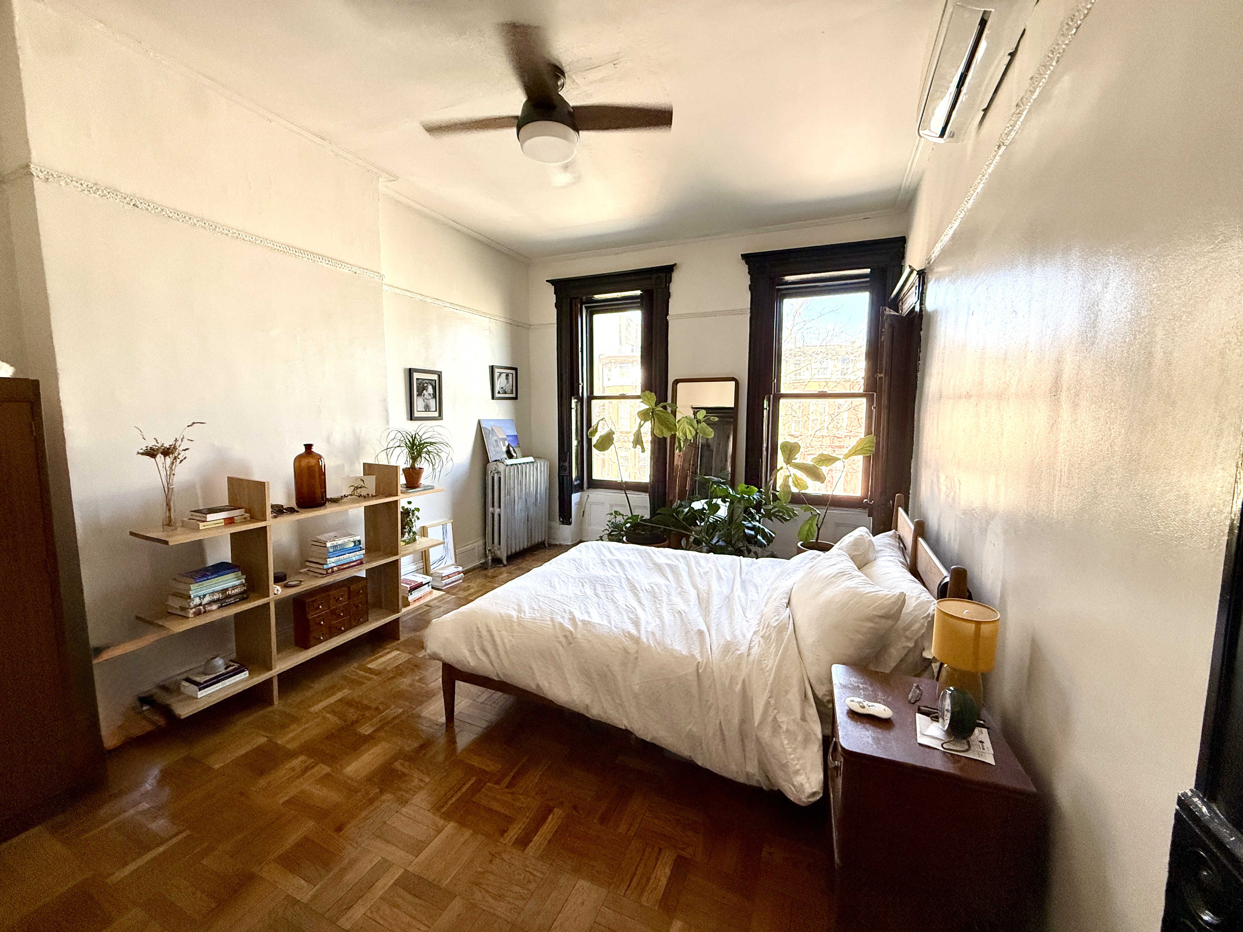 814 Putnam Avenue, Unit 2 Brooklyn, NY 11221 - Photo 4 of 8 a bedroom with a bed and wooden floor