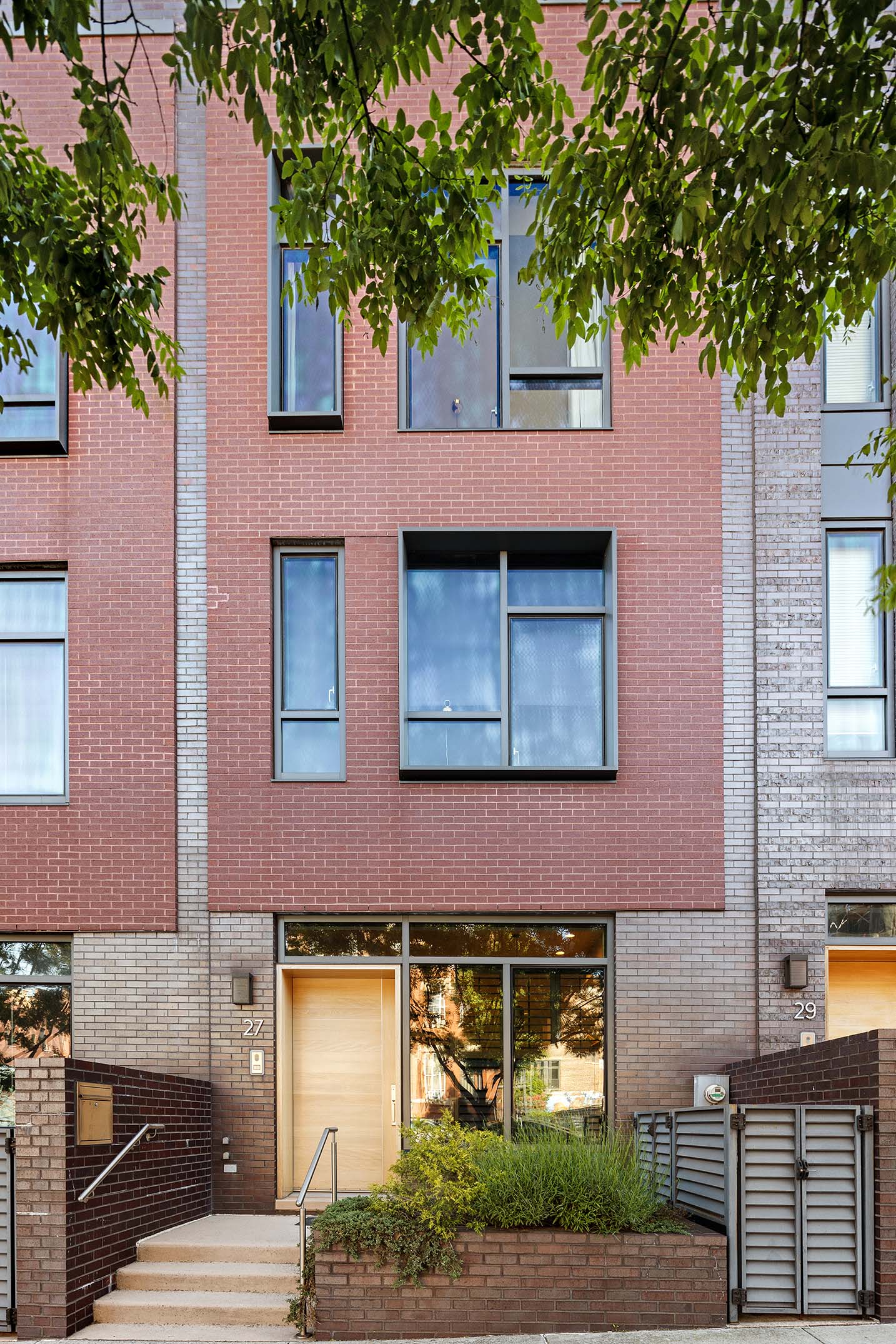 27 Clermont Avenue Brooklyn, NY 11205 - Photo 18 of 19 a building view with a tree in front of it