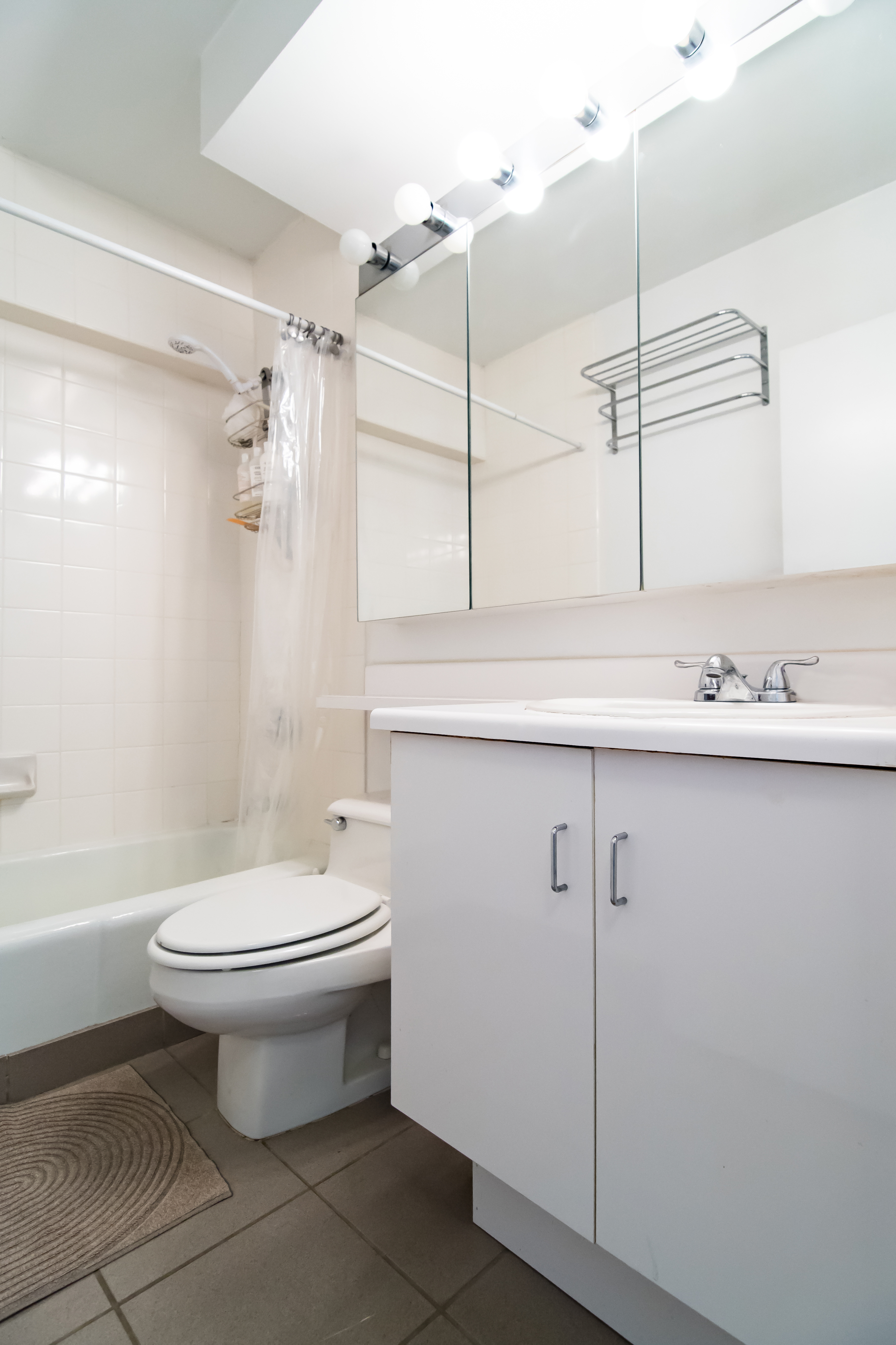 2250 Broadway, Unit 6J Manhattan, NY 10024 - Photo 4 of 10 a bathroom with a sink a toilet and shower