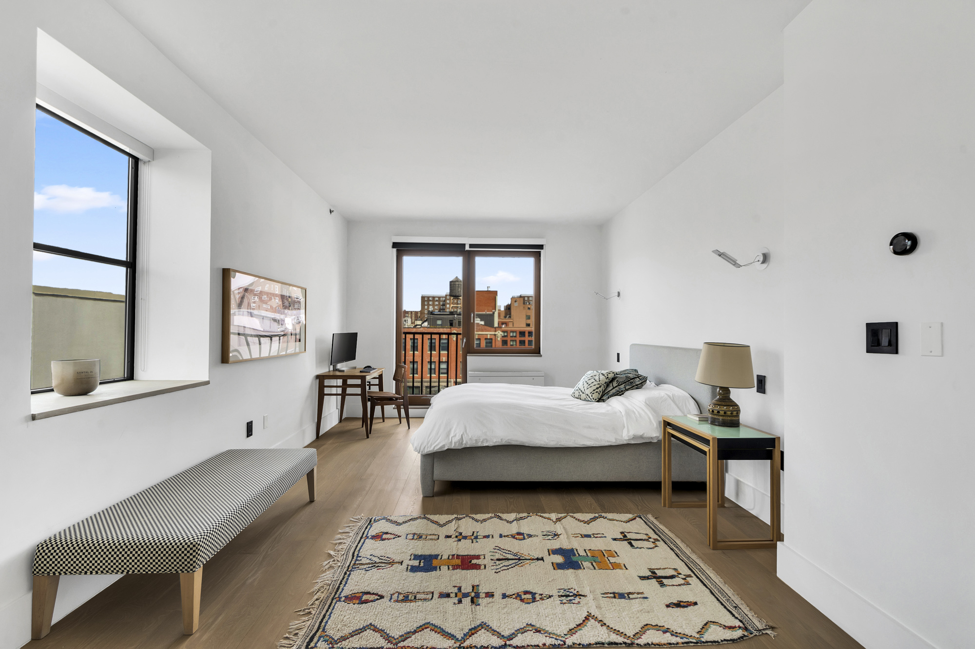 267 West 124th Street, Unit 6A Manhattan, NY 10027 - Photo 13 of 24 a bedroom with a bed and a window