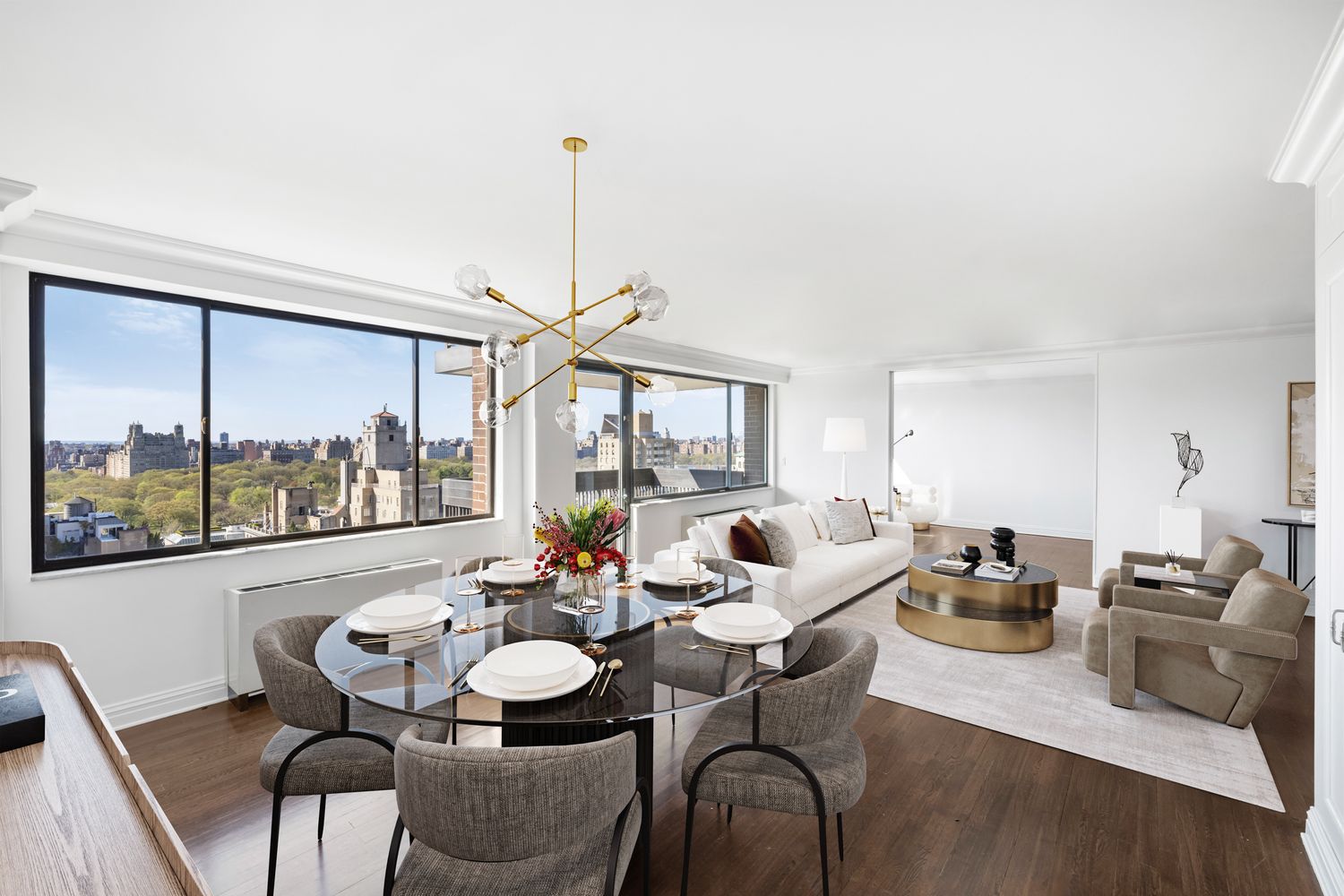 40 East 80th Street, Unit 25A Manhattan, NY 10075 - Photo 3 of 18 a view of a dining room with furniture large windows and wooden floor