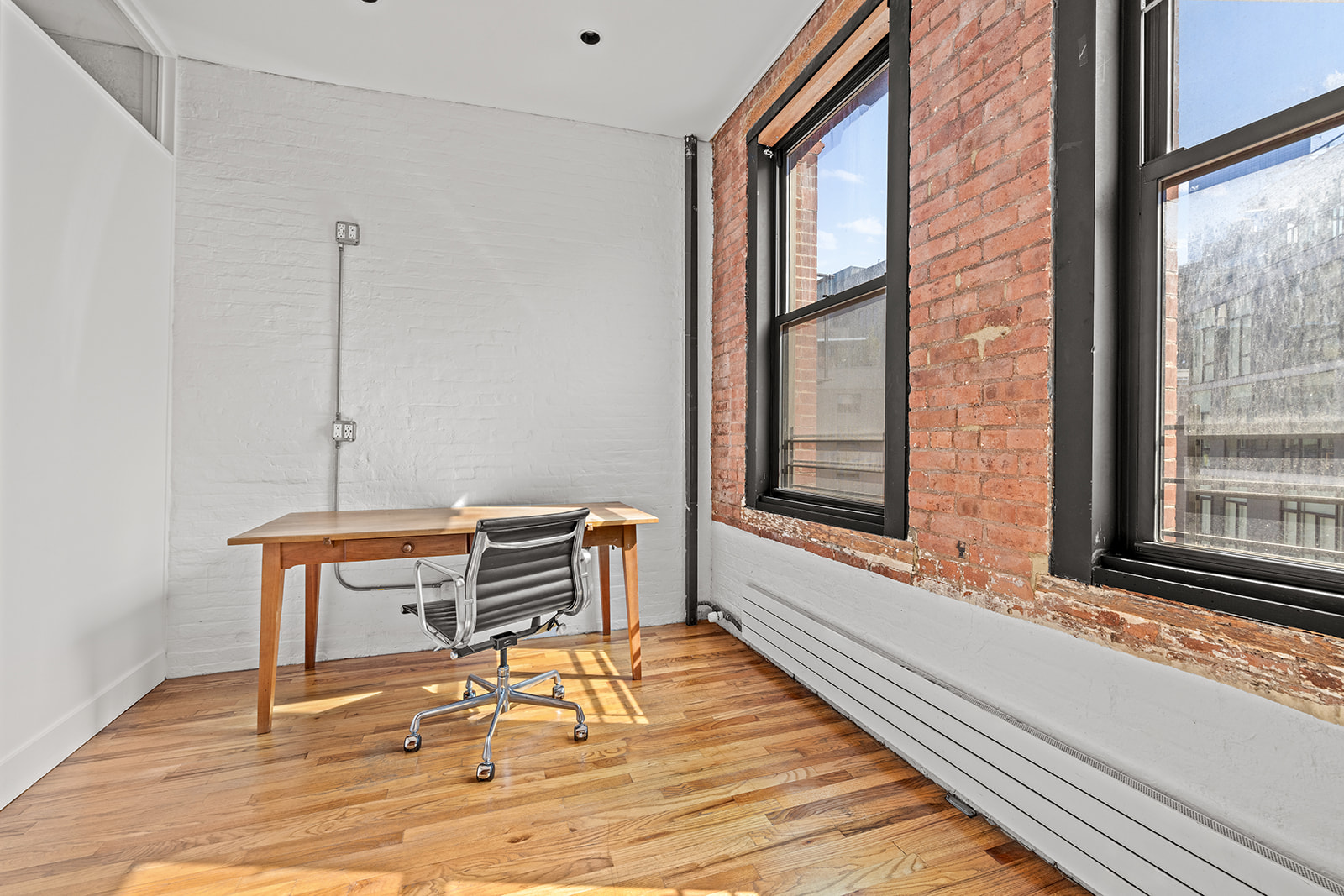 130 Watts Street, Unit 5N Manhattan, NY 10013 - Photo 8 of 11 a view of a chair and table in the room