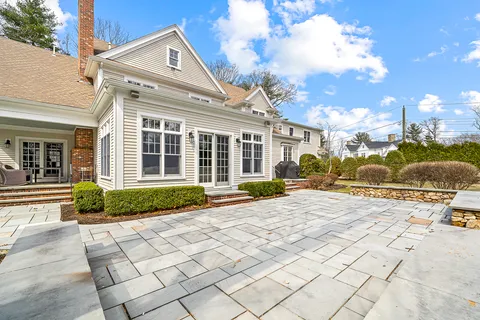 a view of a house with backyard and porch