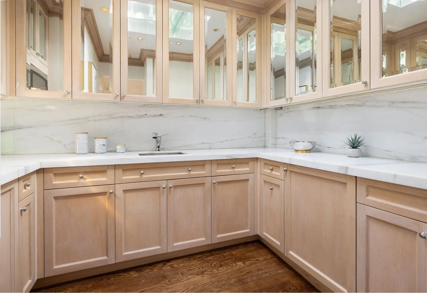 a kitchen with stainless steel appliances granite countertop white cabinets and sink