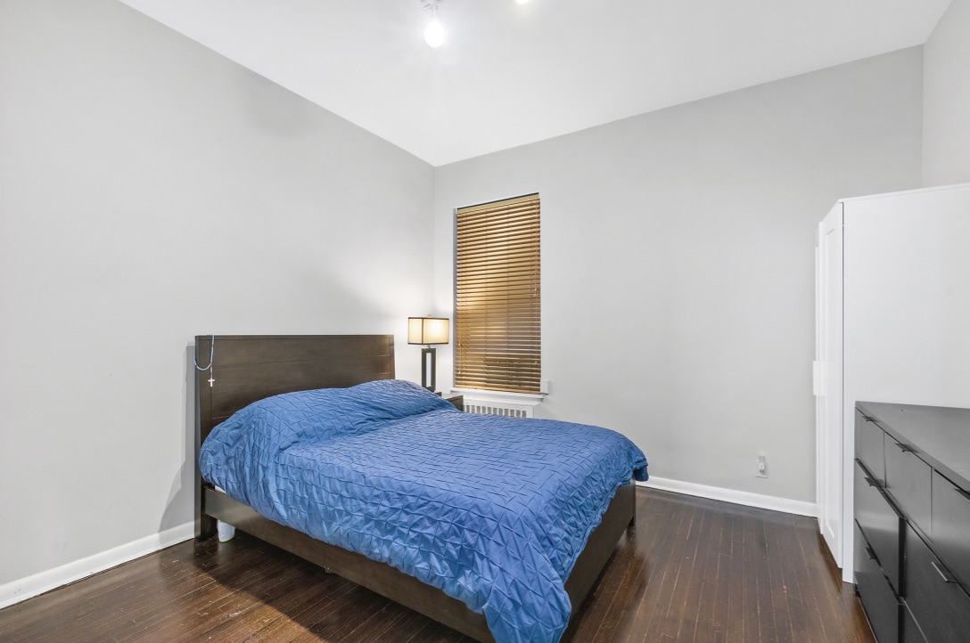 421 West 57th Street, Unit 3C Manhattan, NY 10019 - Photo 4 of 18 a bedroom with a bed and a window