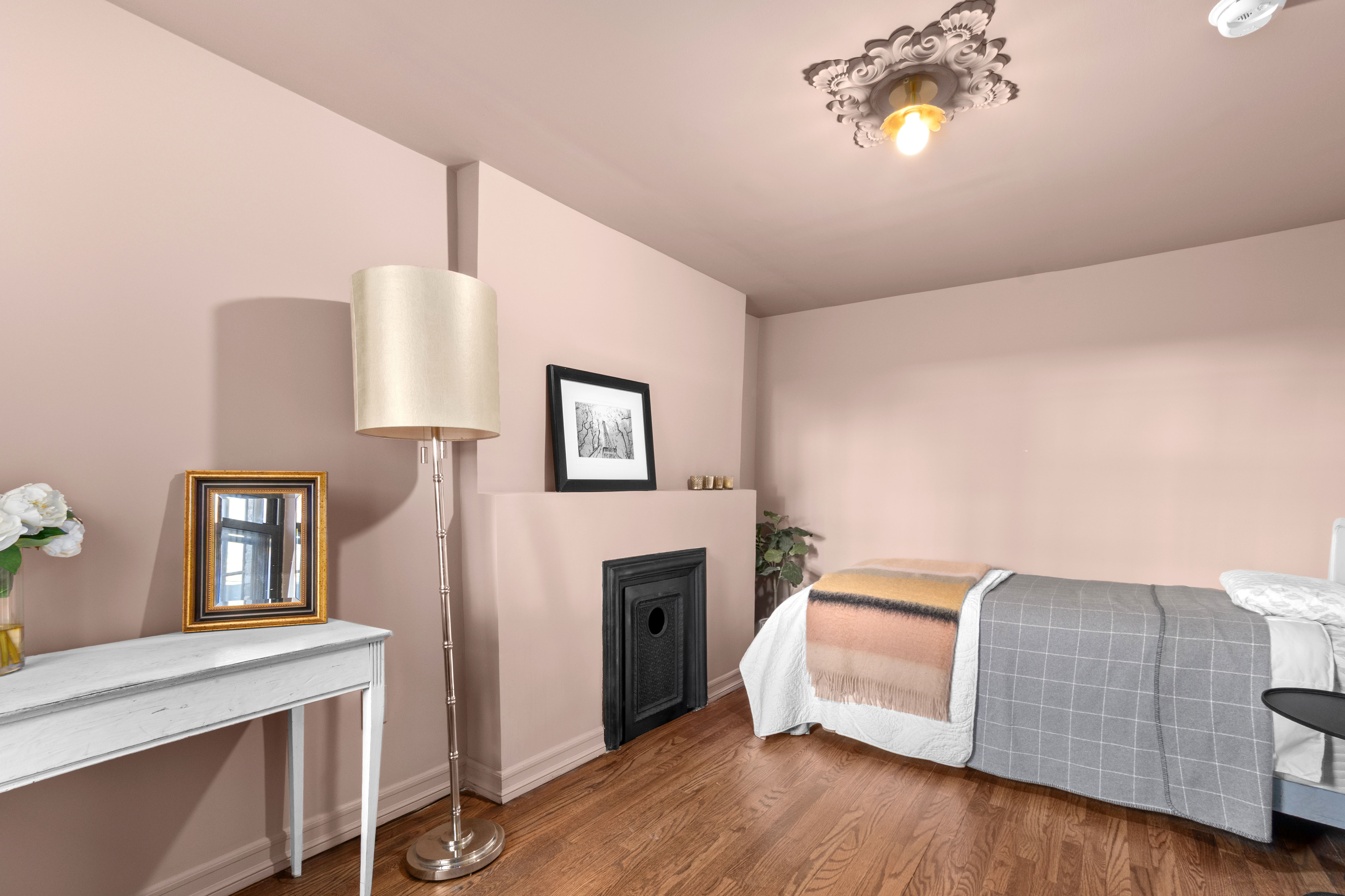191 MacDonough Street, Unit 2 Brooklyn, NY 11216 - Photo 6 of 7 a bed room with a bed and a night stand