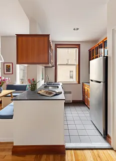 a kitchen with stainless steel appliances granite countertop a refrigerator sink and cabinets