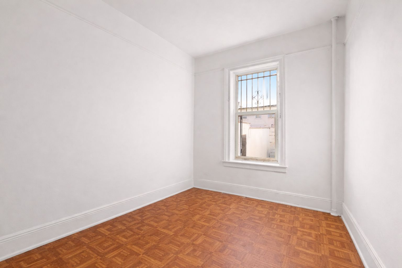 742 44th Street Brooklyn, NY 11220 - Photo 19 of 23 an empty room with windows