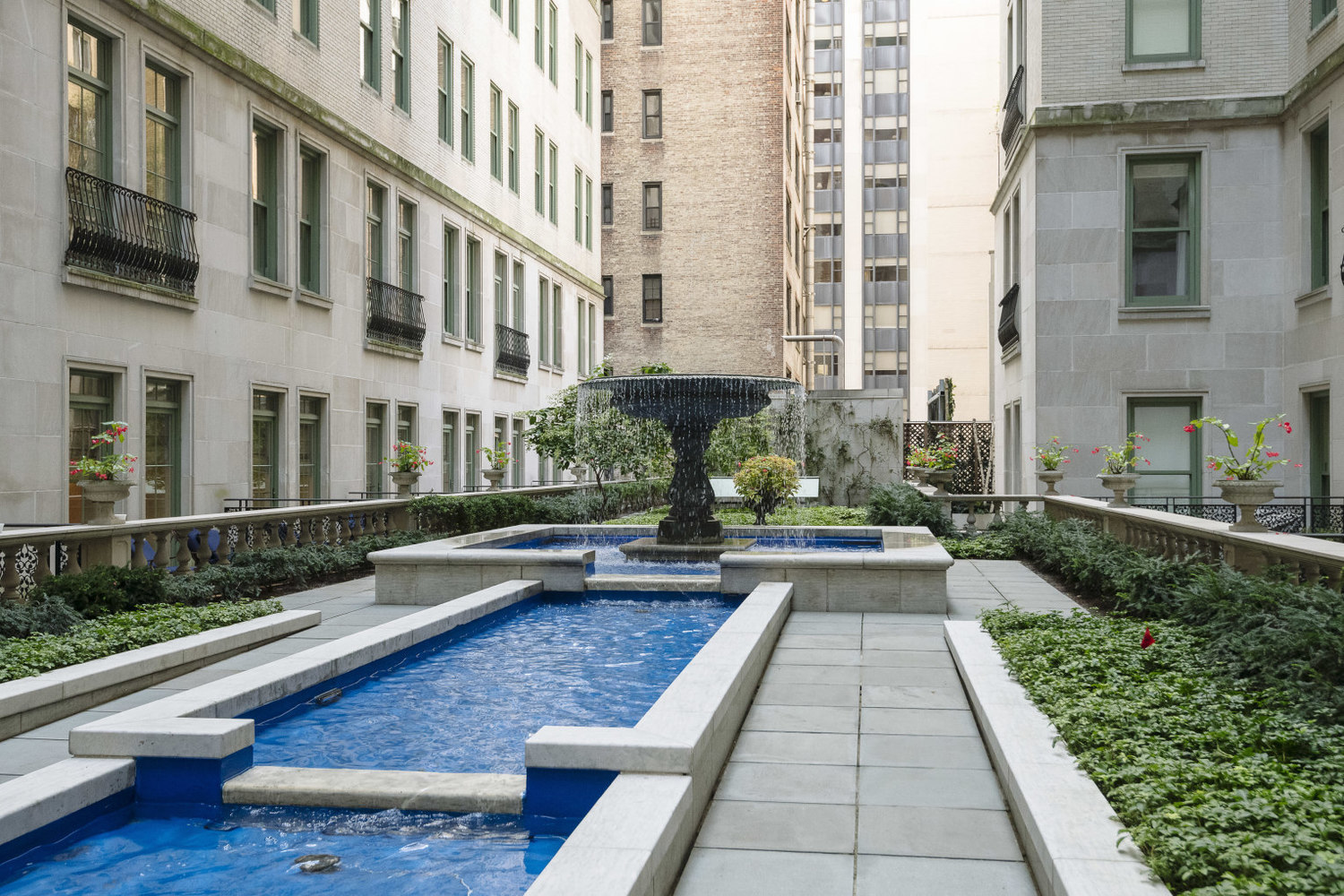 1 Central Park South, Unit 802 Manhattan, NY 10019 - Photo 3 of 16 a view of a building with a yard