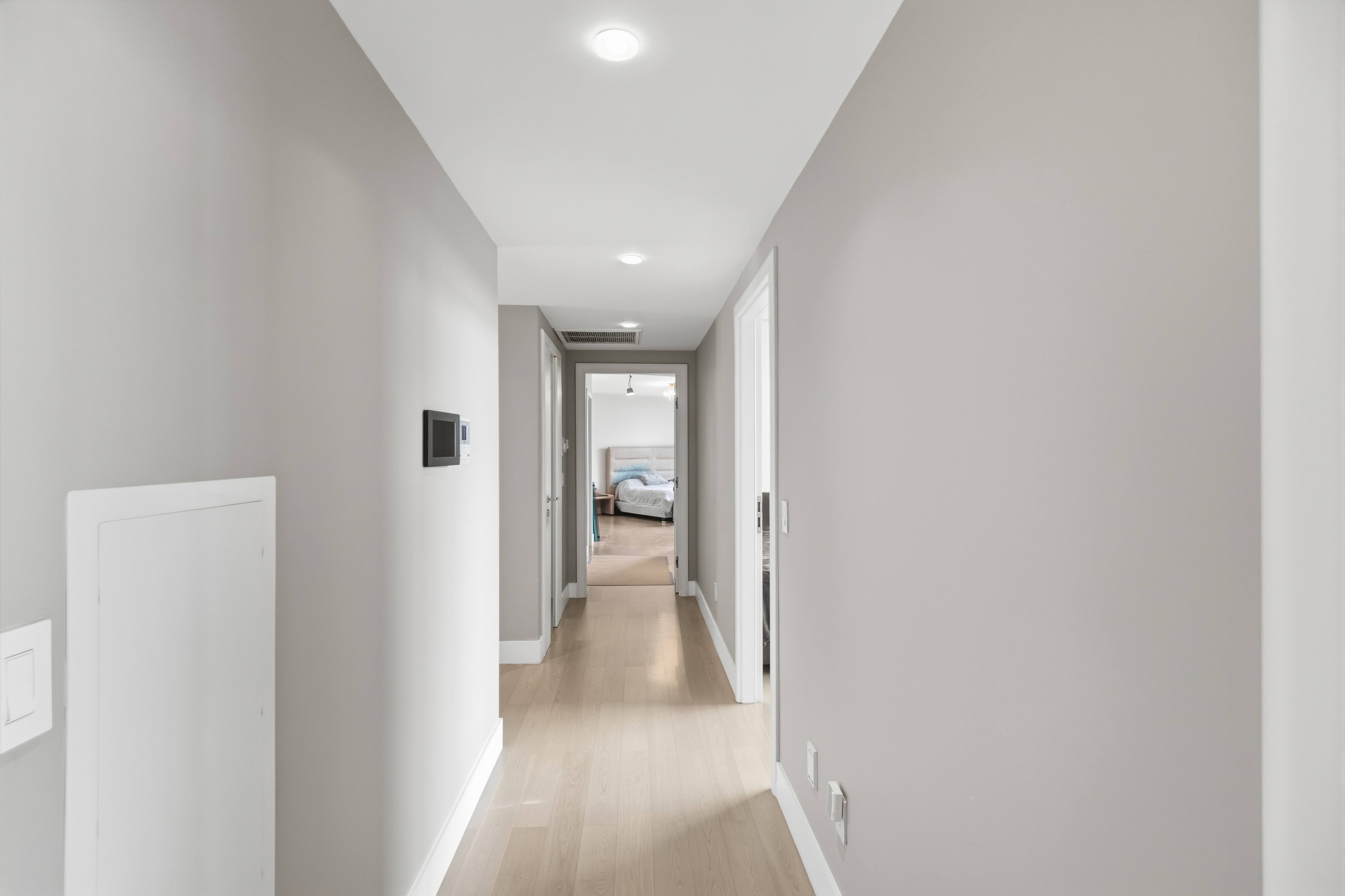 186 Flagg Place Staten Island, NY 10304 - Photo 30 of 44 a view of a hallway with a white walls and stairs