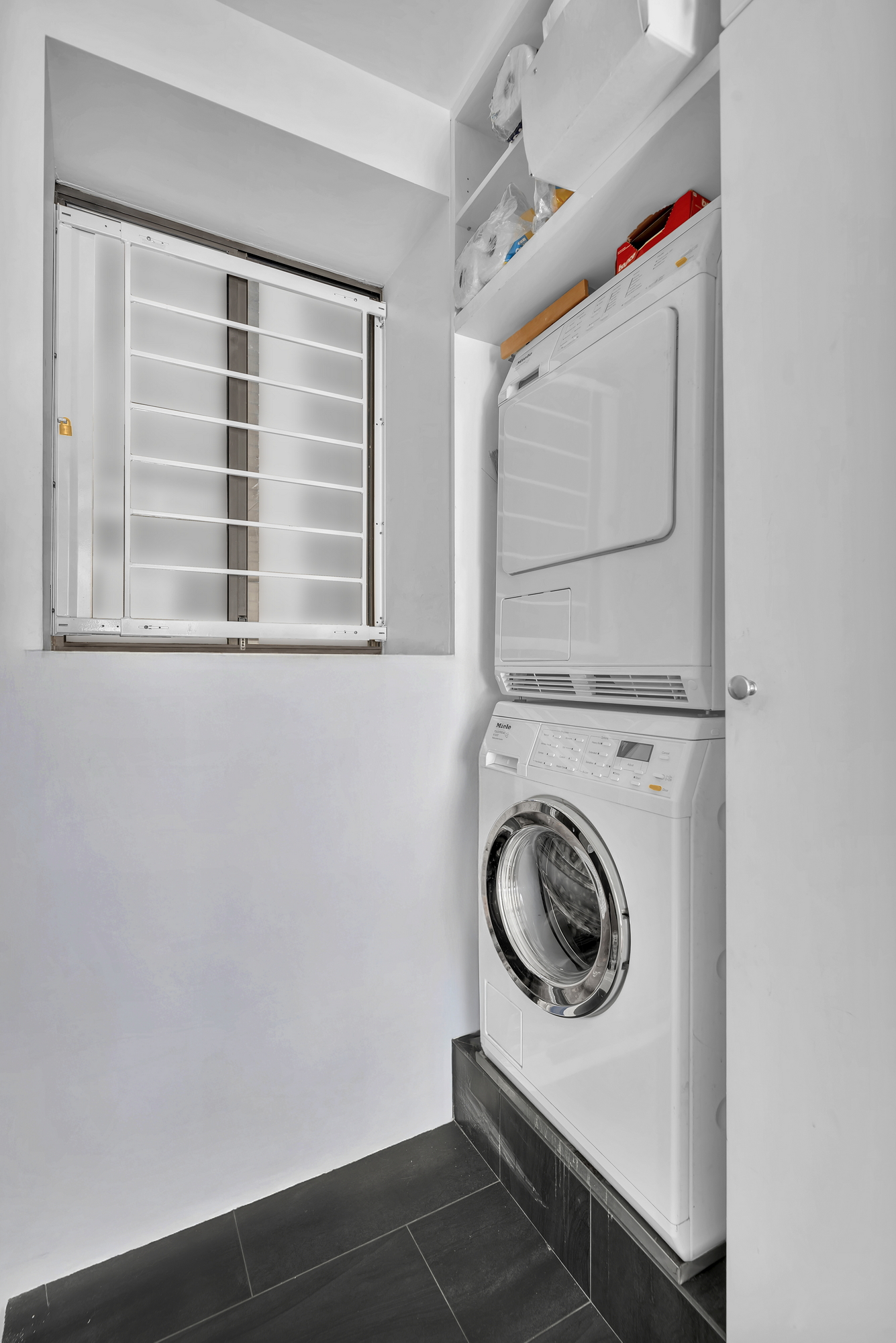 330 West End Avenue, Unit 2B Manhattan, NY 10023 - Photo 11 of 14 a utility room with dryer and washer