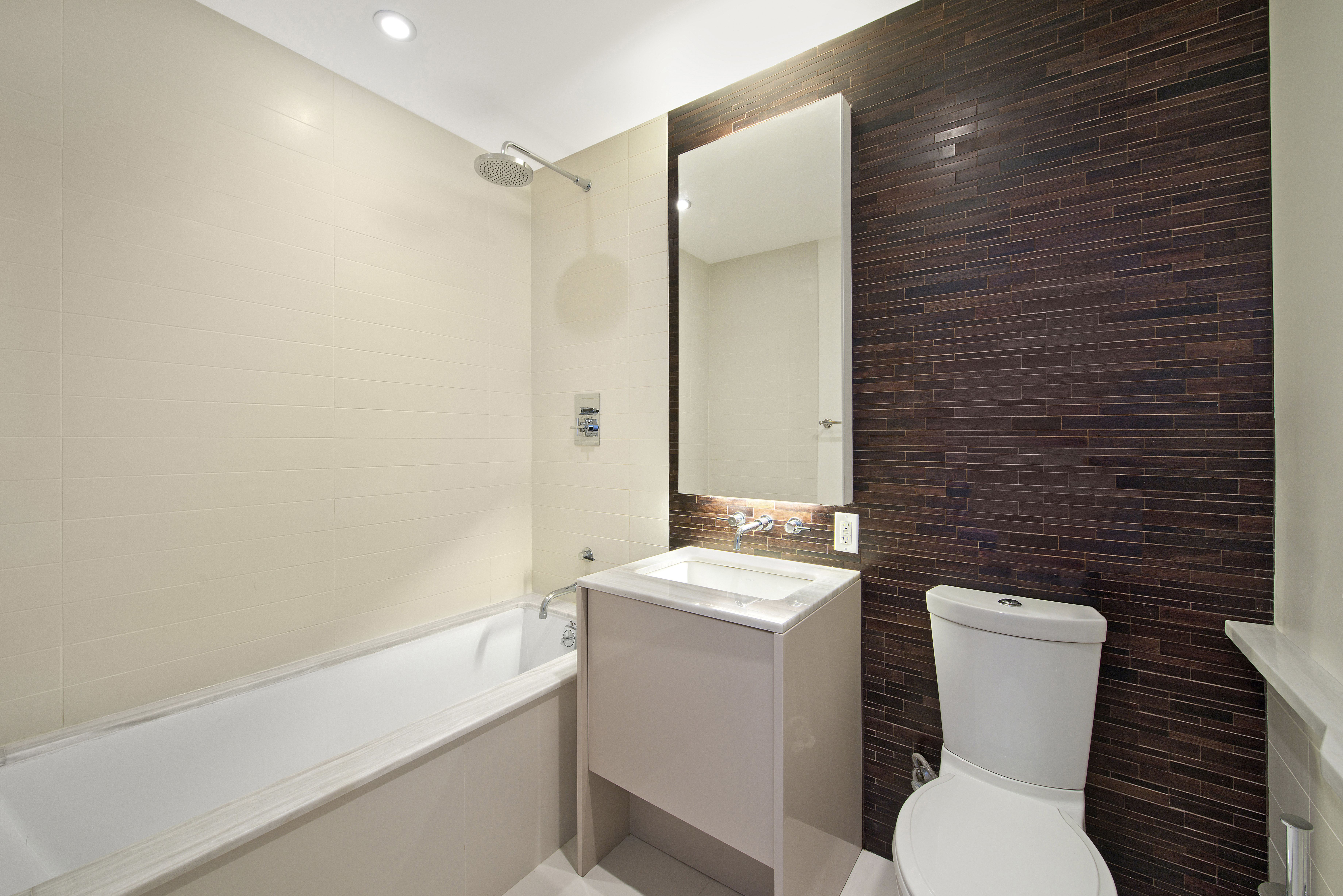 2 Northside Piers, Unit 20C Brooklyn, NY 11249 - Photo 6 of 12 a bathroom with a toilet a sink and a bathtub