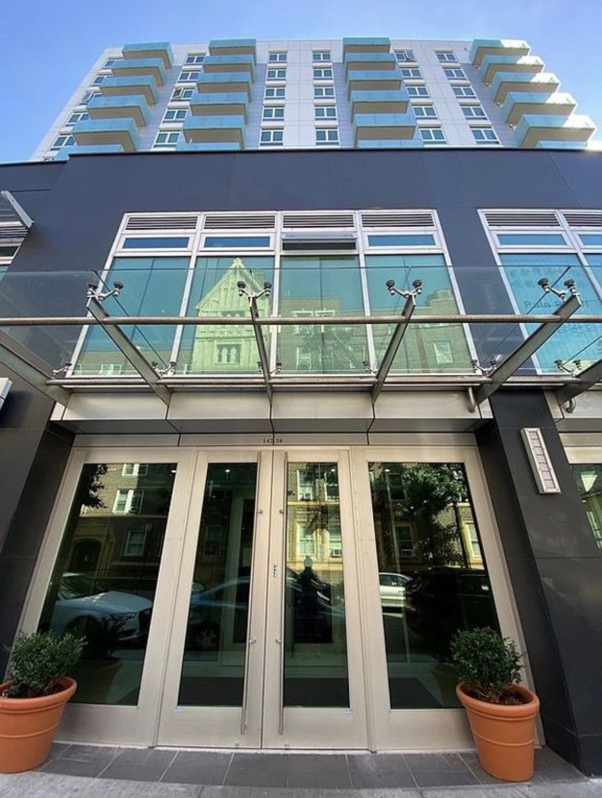142-38 37th Avenue, Unit 2G Flushing, NY 11354 - Photo 1 of 8 a building view with a garden space
