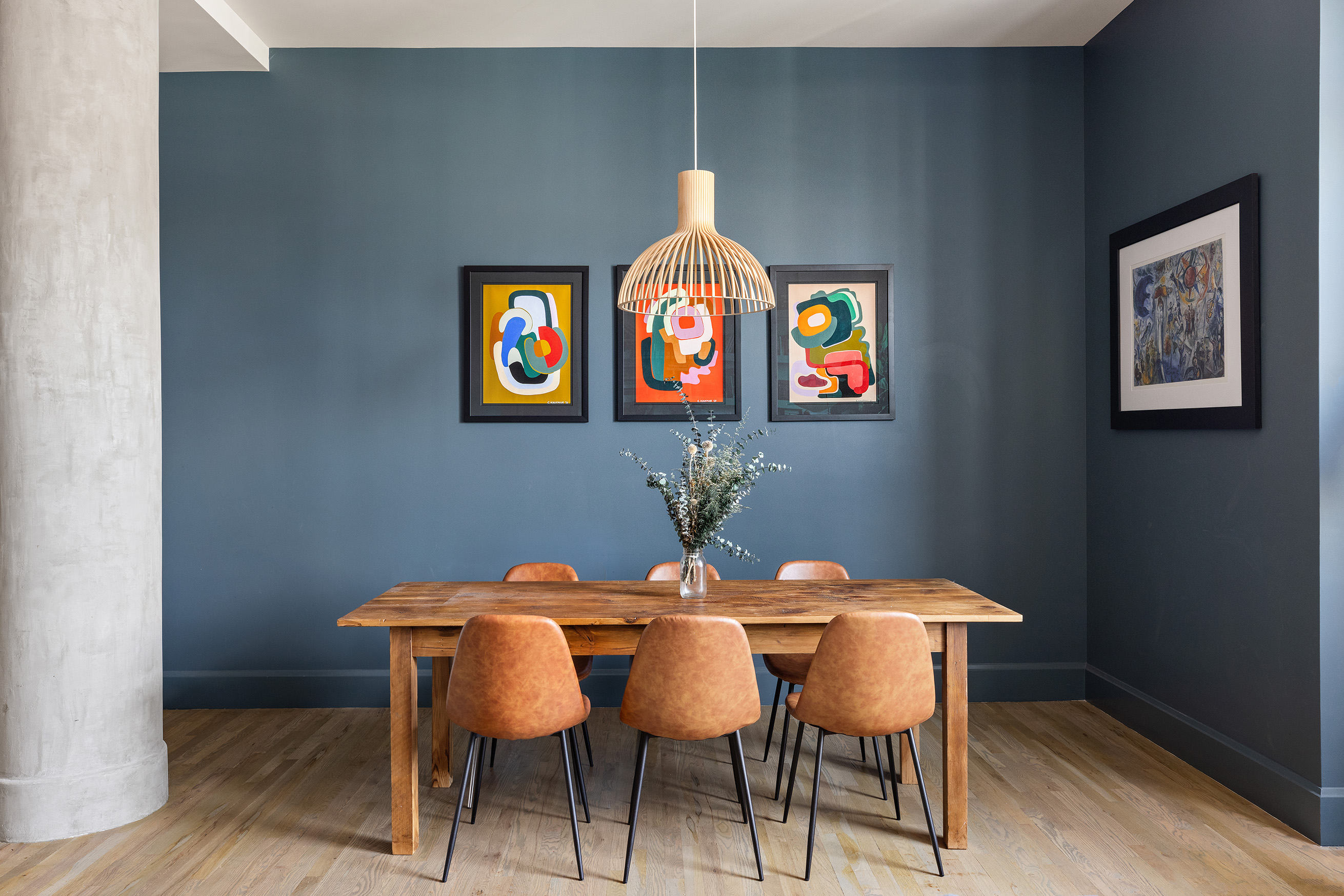 250 Mercer Street, Unit B1401 Manhattan, NY 10012 - Photo 4 of 8 a view of a dining room with furniture and wooden floor