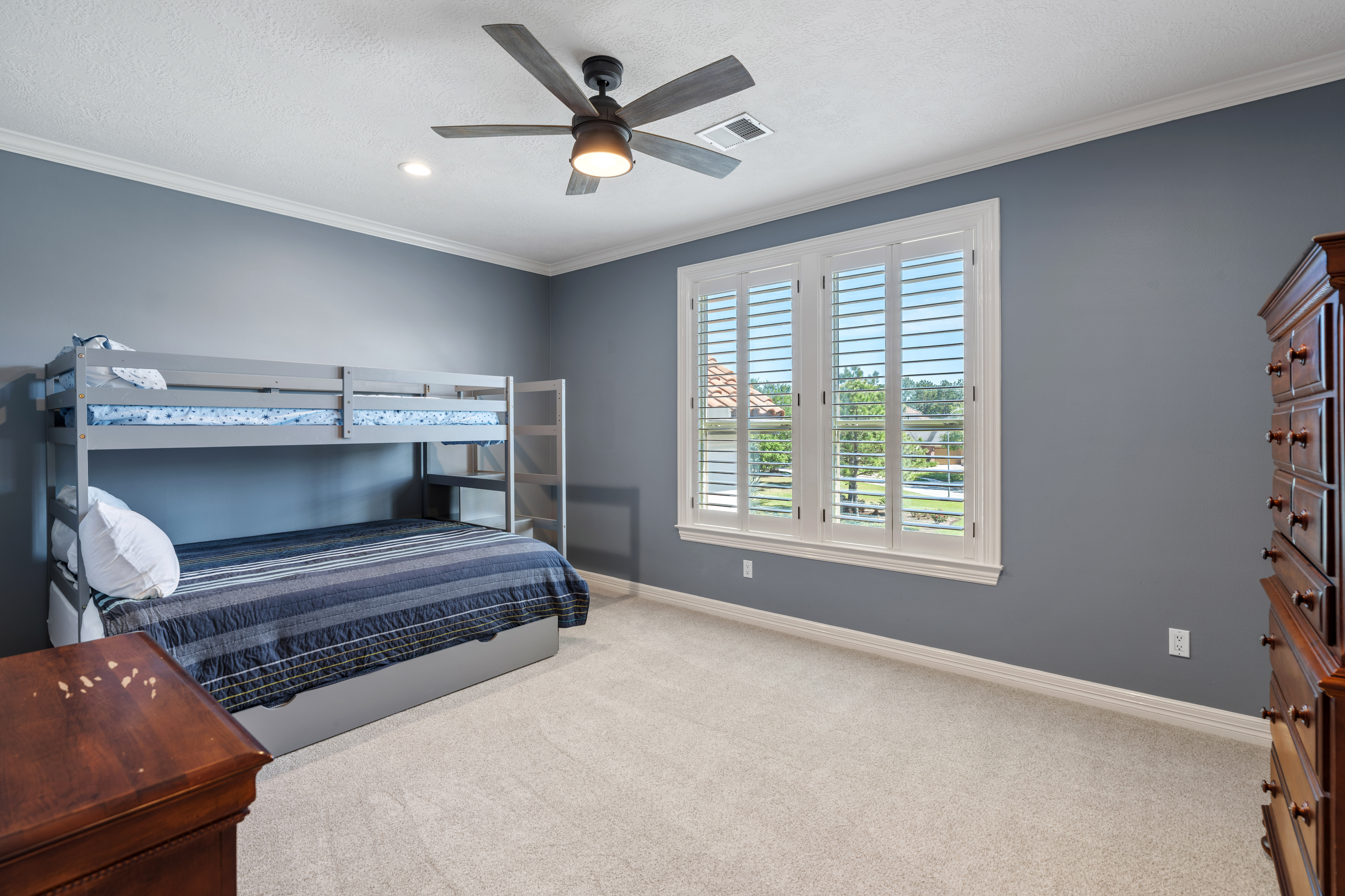82 Manor Lake Estates Circle Spring, TX 77379 - Photo 32 of 52 a bedroom with a bed and a ceiling fan