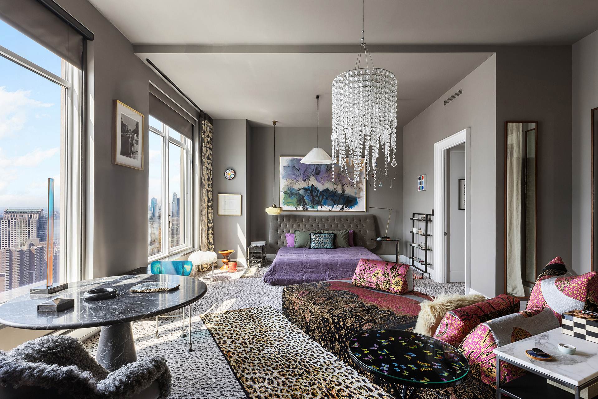 30 Park Place, Unit 59A Manhattan, NY 10007 - Photo 8 of 23 a bedroom with furniture and a chandelier