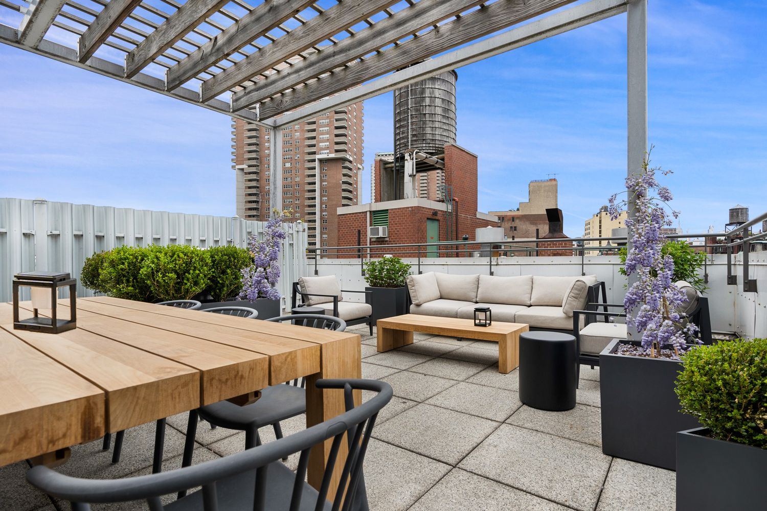 303 Greenwich Street, Unit 8DE Manhattan, NY 10013 - Photo 18 of 20 a outdoor living space with furniture and a potted plant