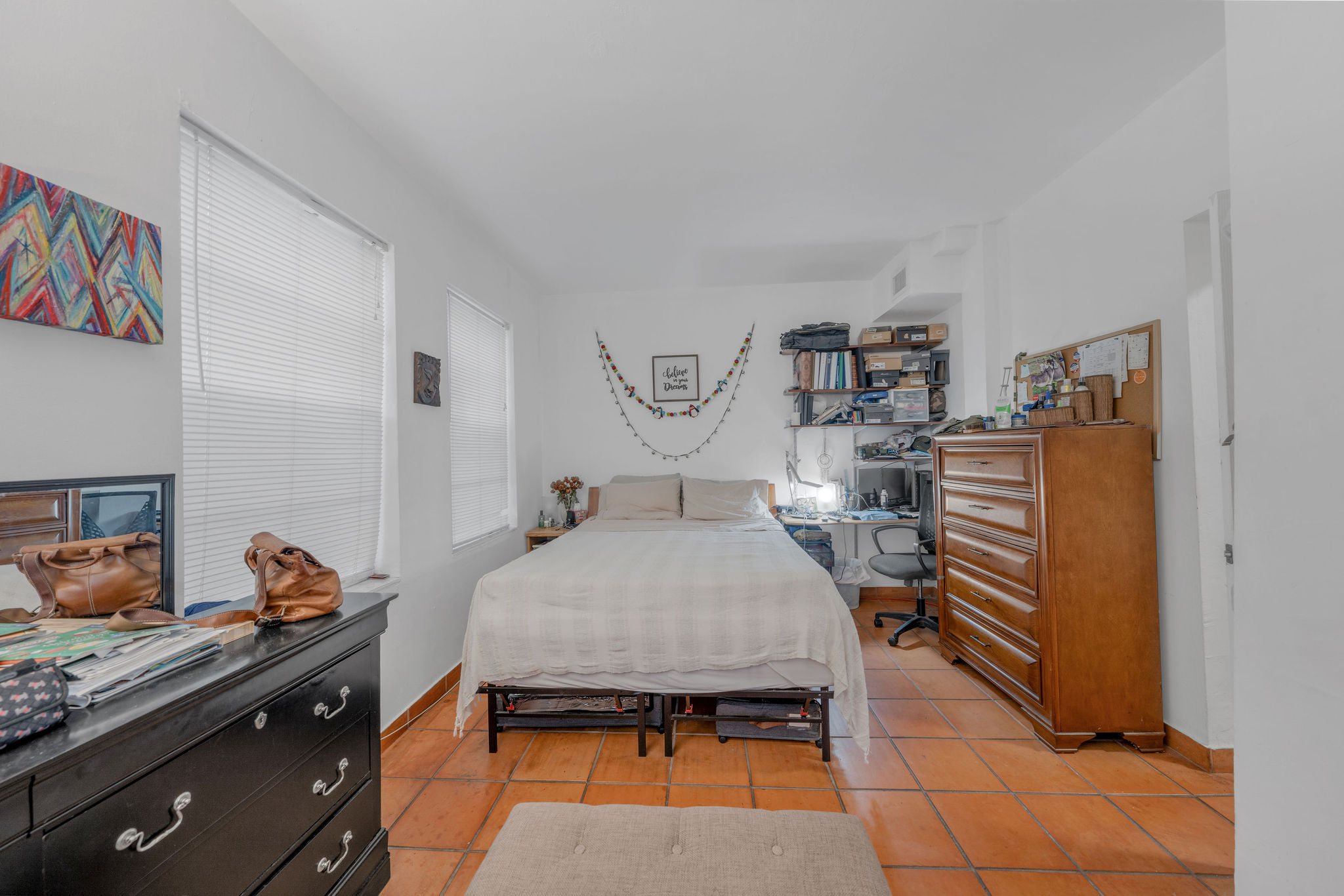 735-745 Meridian Avenue Miami Beach, FL 33139 - Photo 47 of 62 a bed room with a bed and a chandelier