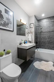 a bathroom with a sink toilet and bathtub
