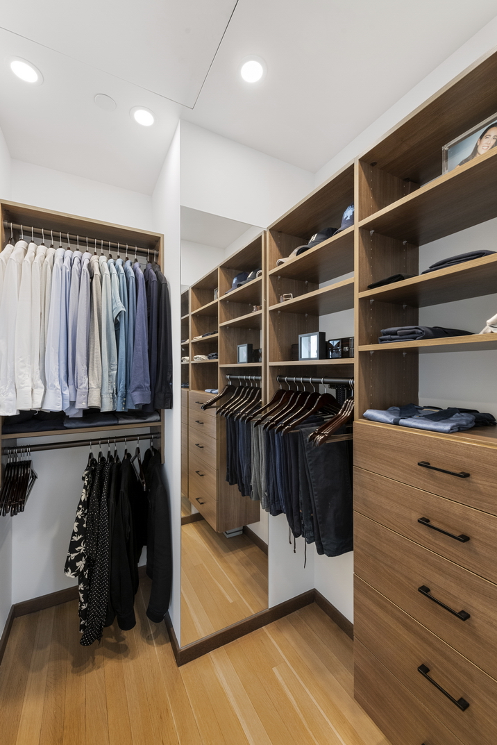 551 West 21st Street, Unit 4D Manhattan, NY 10011 - Photo 9 of 16 a view of walk in closet with clothes and shoes
