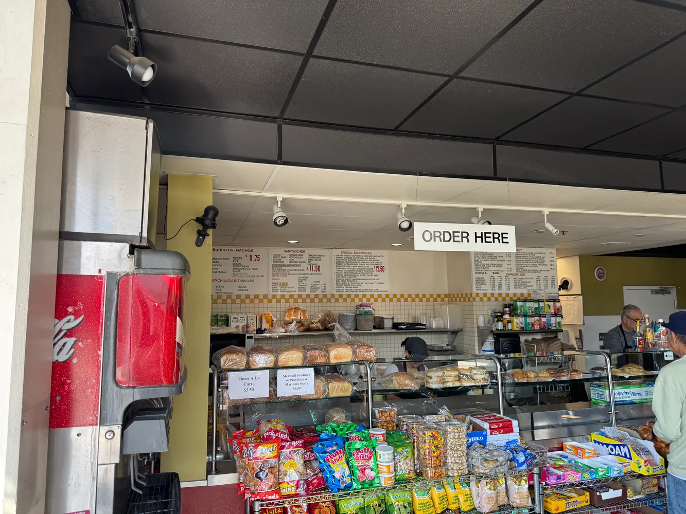 a store room with lots of furniture and clutter
