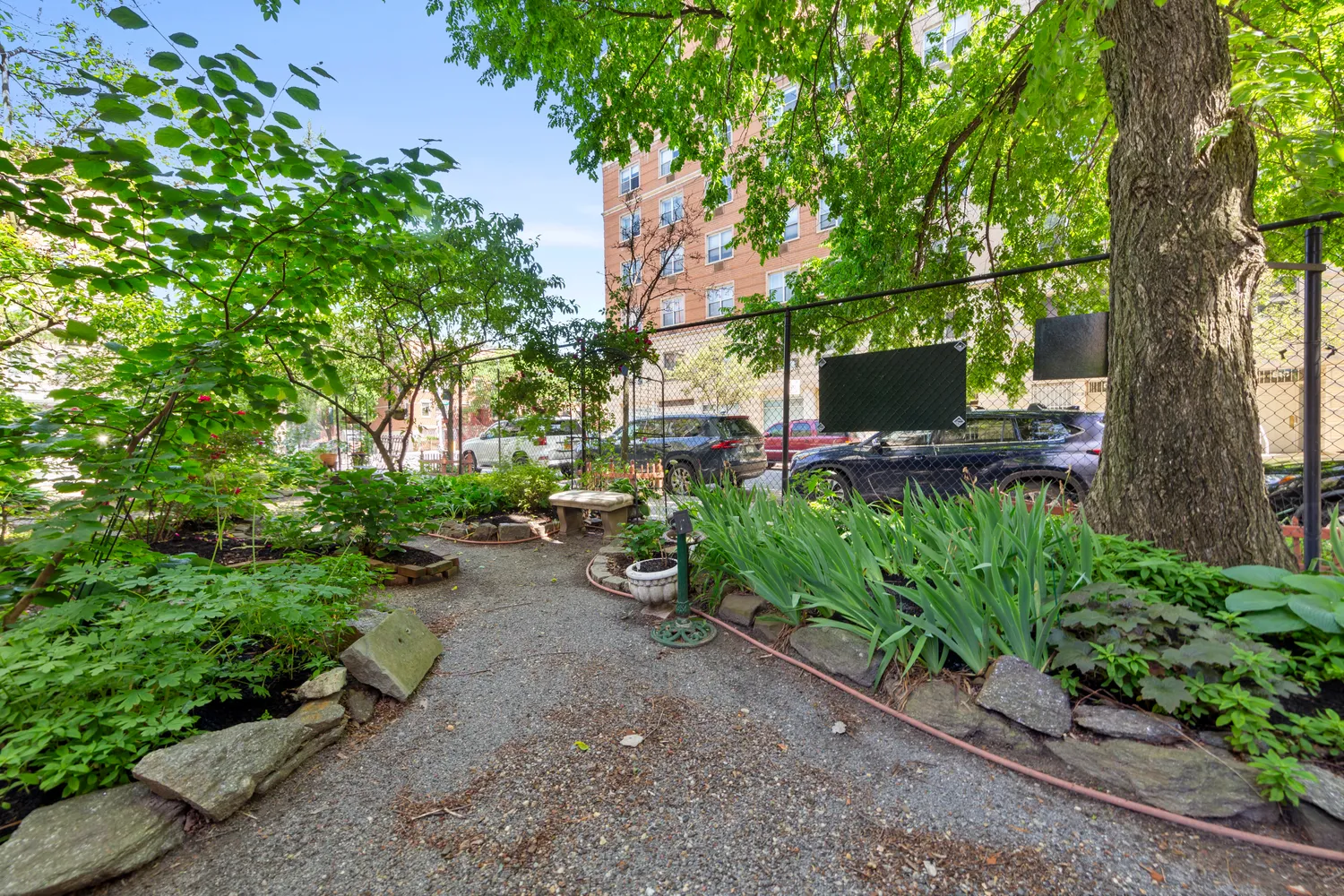 a view of street with parked cars