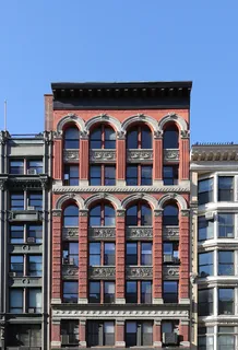 a front view of multi story residential apartment building