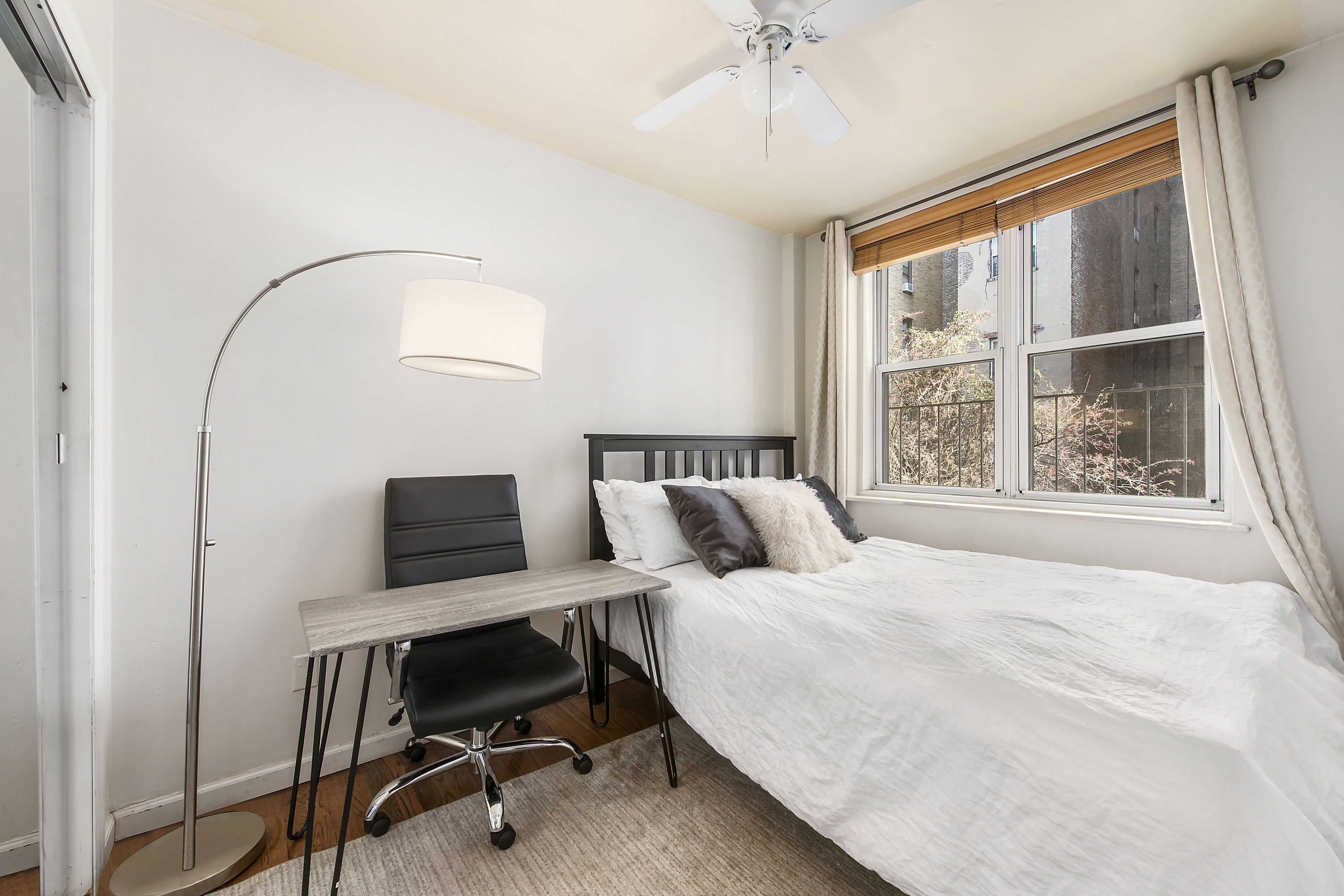 131 West 85th Street, Unit 2A Manhattan, NY 10024 - Photo 3 of 6 a bedroom with a bed and a window