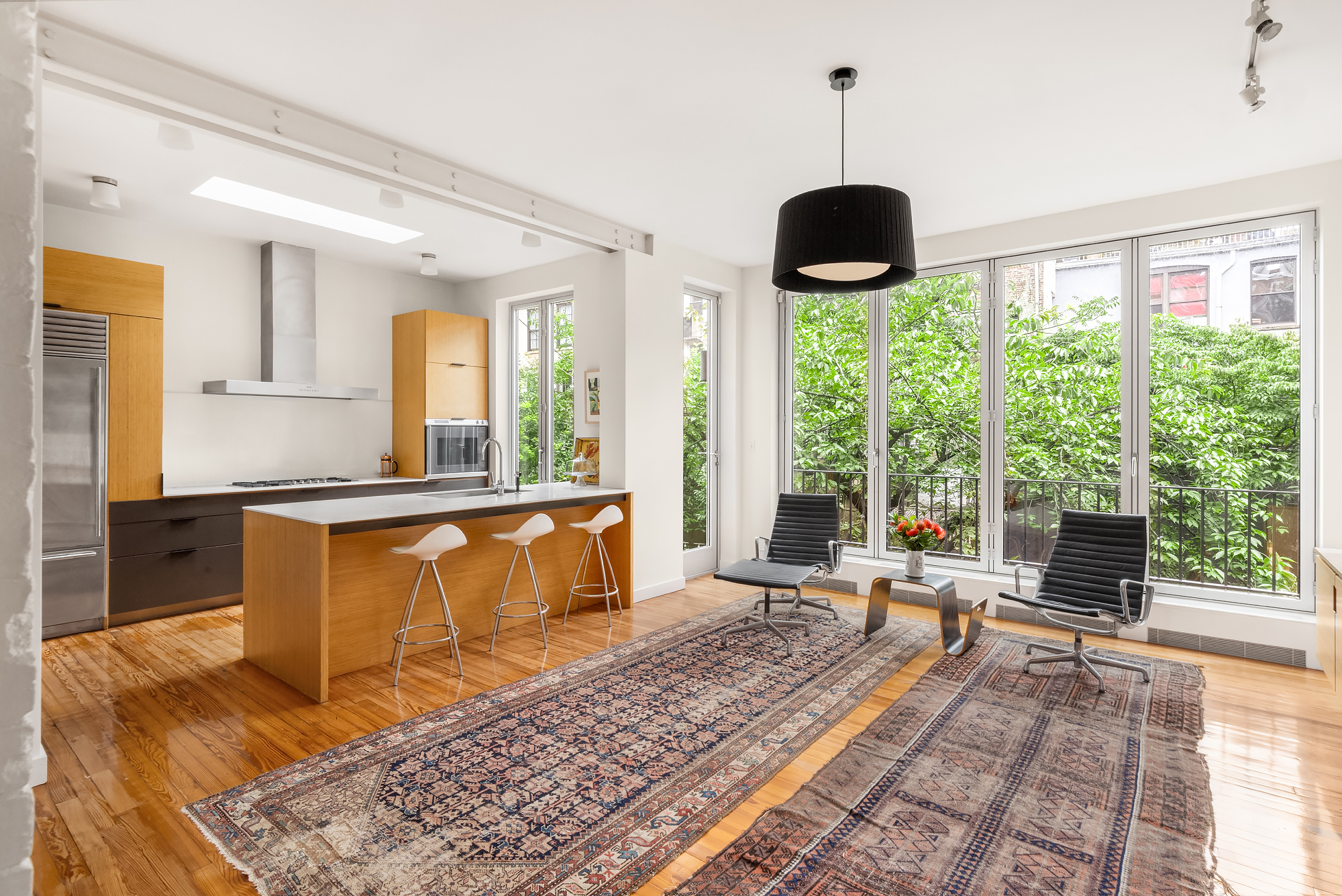 128 State Street, Unit 2 Brooklyn, NY 11201 - Photo 5 of 15 a living room with furniture and a large window