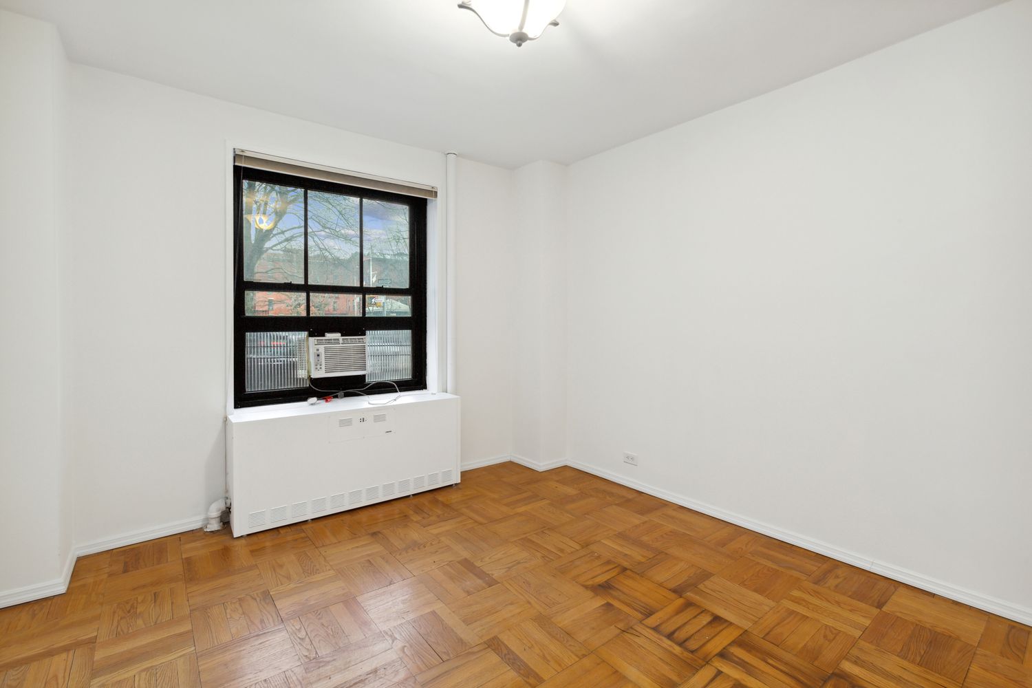 355 Clinton Avenue, Unit 1F Brooklyn, NY 11238 - Photo 8 of 14 a view of an empty room with a window