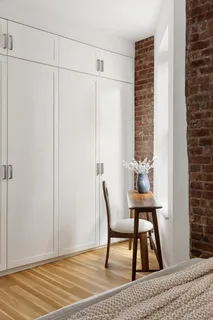 a view of a room with furniture and wooden floor