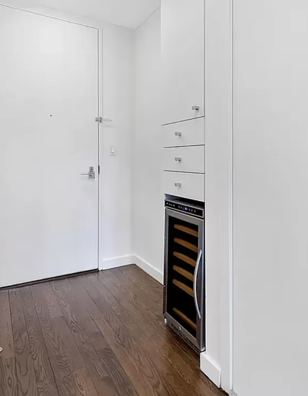 133 West 22nd Street, Unit 7H Manhattan, NY 10011 - Photo 13 of 21 an empty room with wooden floor