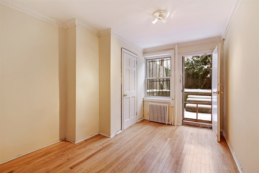 49 Saint Marks Avenue, Unit 1 Brooklyn, NY 11217 - Photo 5 of 21 an empty room with wooden floor and windows