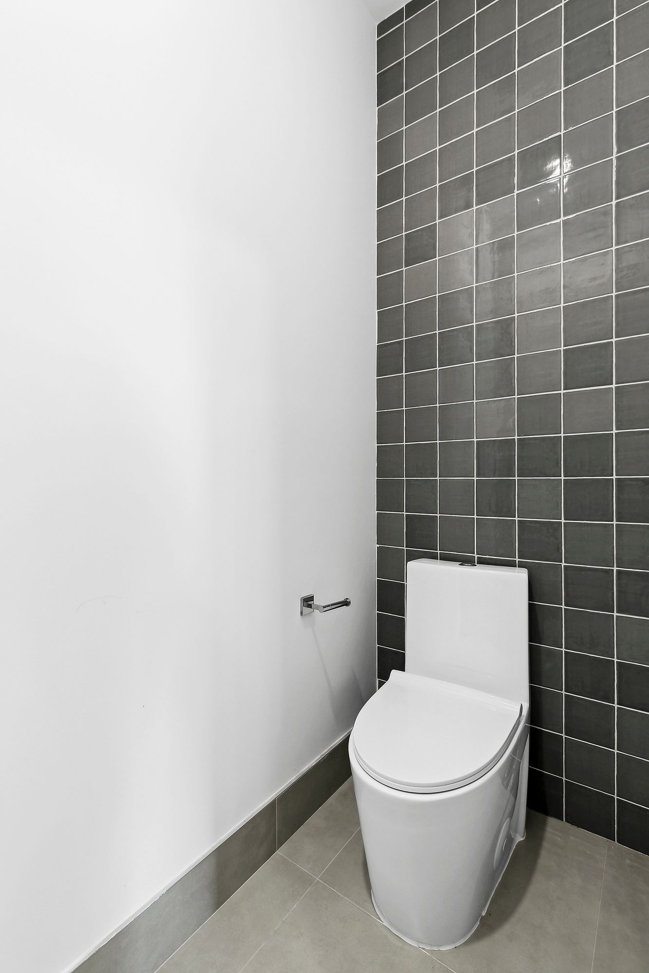 138 Schaefer Street, Unit 3A Brooklyn, NY 11207 - Photo 7 of 10 a white toilet sitting next to a bathroom sink