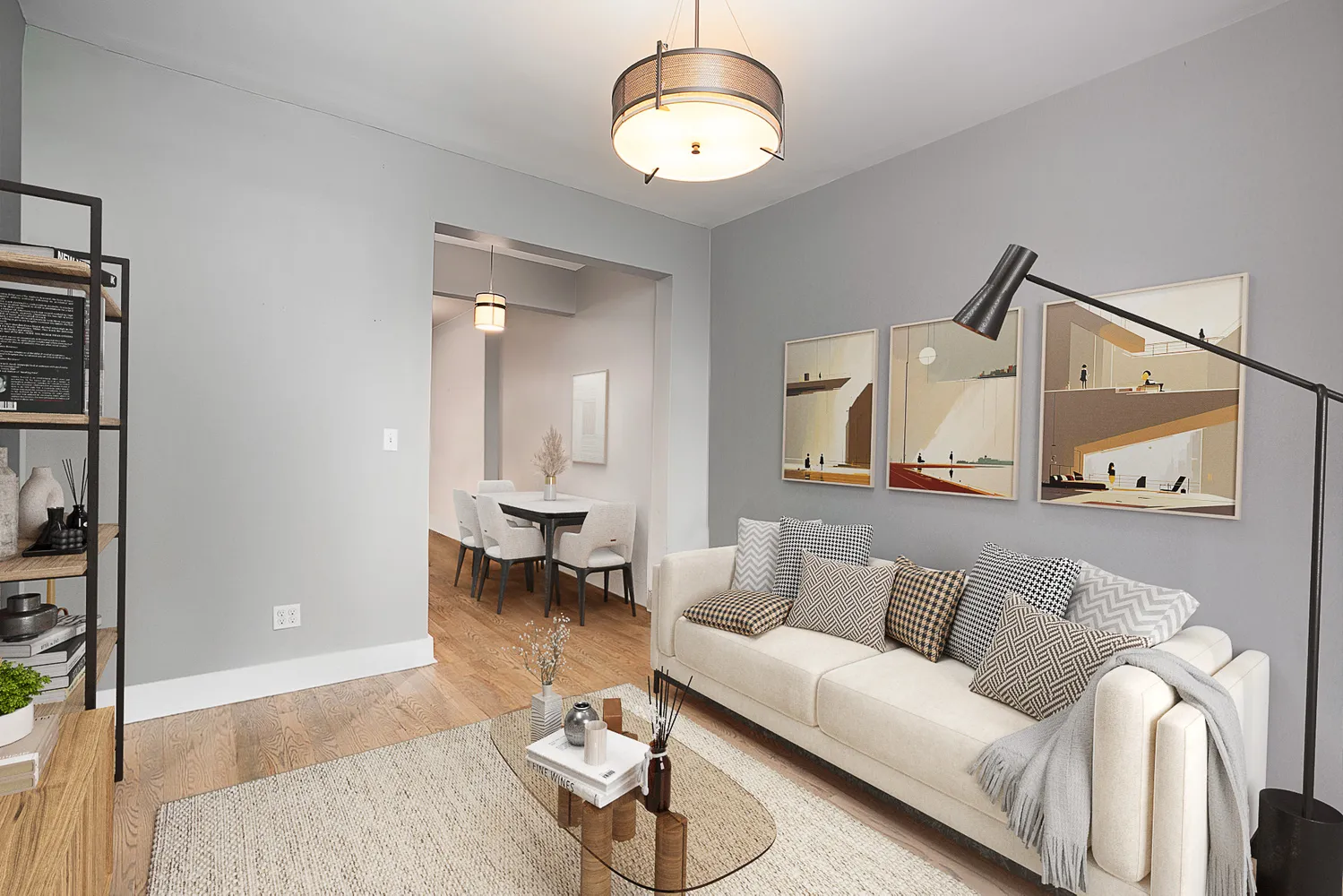 a living room with furniture and wooden floor