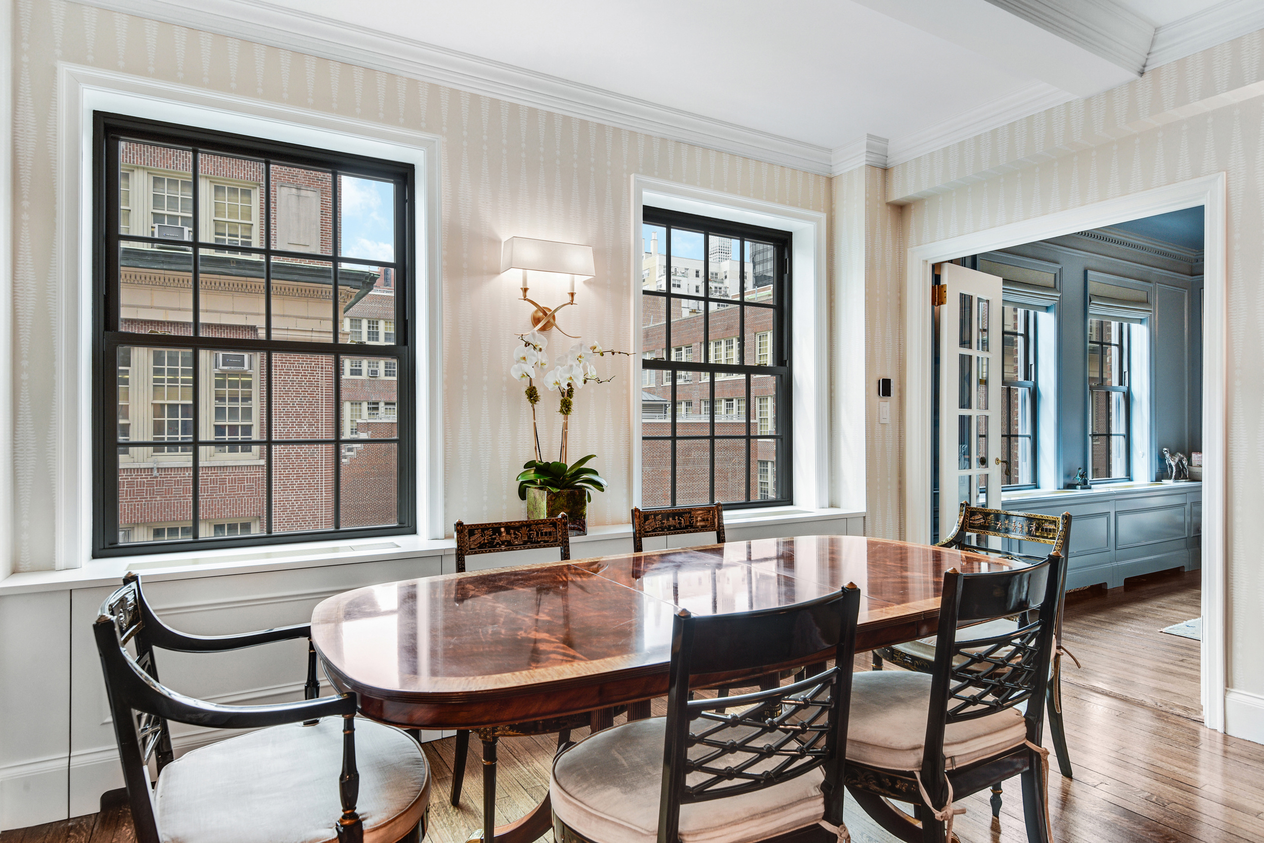 333 East 68th Street, Unit 6C Manhattan, NY 10065 - Photo 2 of 13 a dining room with furniture and window